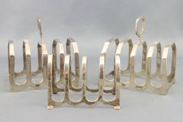 A pair of silver four slice toast racks in the art deco style,