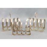 A pair of silver four slice toast racks in the art deco style,