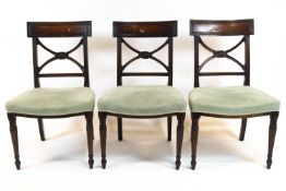 A set of six mahogany Regency style dining chairs,