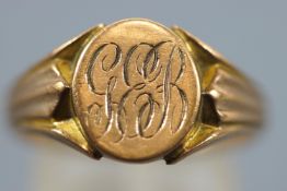 A yellow and rose metal signet ring. Oval head with personal inscription.