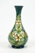 A Moorcroft 'Carousel Jasmine' pattern vase, of baluster form with long flared neck, circa 1996,
