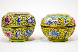 A pair of Canton enamel lobed circular yellow ground boxes and covers, decorated with figures,