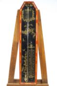 An early 20th century barometer, the red and black japanned case decorated in chinoiserie style,