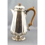 A silver coffee jug, of tapered, ribbed quatrefoil form, with a hinged domed cover,