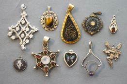 A collection of ten pendants of variable designs, most marked for sterling silver 925.