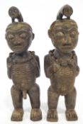 A pair of North African, possibly Benin, carved wooden fertility figures,