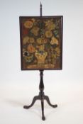 A mahogany adjustable fire pole and tapestry fire screen, on baluster stem and tripod scroll base,