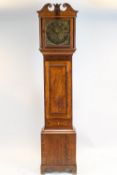 A late 18th century oak long cased clock,