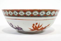 A Japanese porcelain bowl, painted in enamels with koi carp,