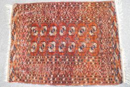 A rug with two rows of seven medallions on a red field within multiple borders,