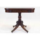 A William IV mahogany turn over tea table, with rounded corners, carved with palmettes,