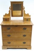 A Victorian pine dressing table chest, with hinged rectangular mirror,