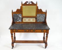 A 19th century pitch pine washstand with decorative shaped back with broken pediment