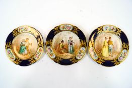 Three Sevres French porcelain cabinet plates decorated with scenes of lovers in rural landscapes in