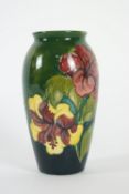 A Moorcroft 'Hibiscus' pattern green ground, oriform vase, early 20th century,