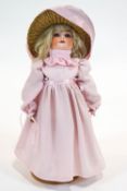 A German (William Goebel) bisque headed doll, with jointed composition body,