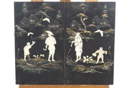 A pair of early 20th century Japanese panels decorated with applied bone figures in a painted