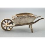 A small silver novelty stamp box in the form of a garden wheelbarrow, Birmingham 1907, 17 grams.