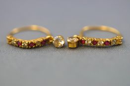 A yellow metal pair of hoop earrings set with synthetic rubies and colourless cubic zirconia.