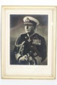 A framed black & white, signed photograph of a Naval Vice Admiral,