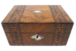 A Victorian walnut work box with two parquetry bands flanking a shell inlaid top and escutcheon,