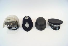 A policeman's uniform, including a Gloucestershire Constabulary helmet, a whistle, truncheon,