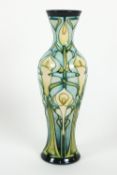 A Moorcroft 'Calla Lily' pattern slender baluster vase, circa 2001, printed and painted marks,