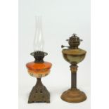 A 20th century brass and black reeded column oil lamp, 65cm high,