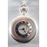A demi hunter silver pocket watch together with a fancy albert chain
