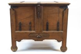 An Indian iron bound teakwood dowry chest, with hinged top above a frieze drawer,