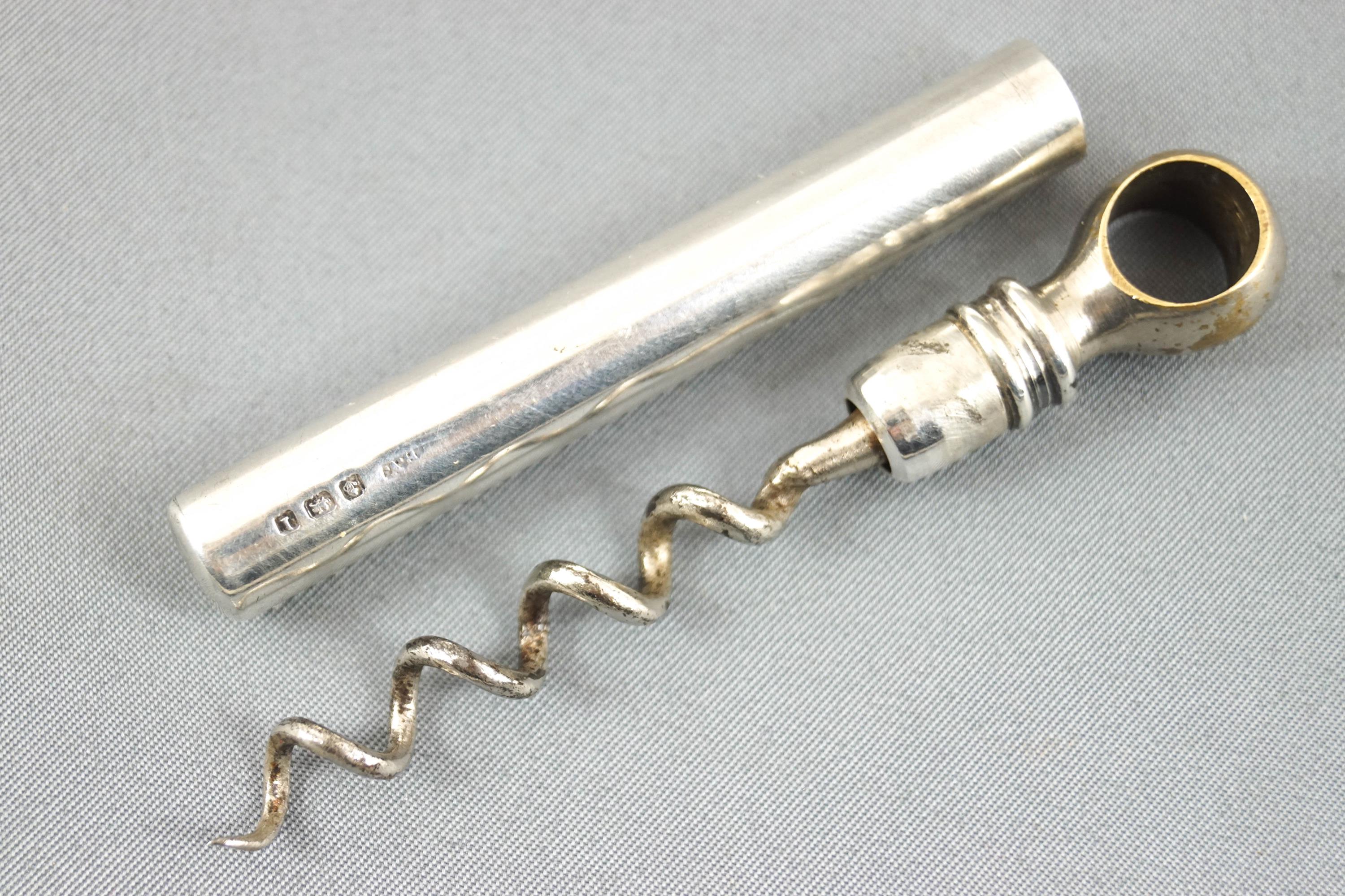 A silver corkscrew, Birmingham 1910, of tube form with pull out screw, 9 cm,