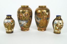 Two pairs of Japanese meiji period vases, the first decorated in the satsuma palette with figures,