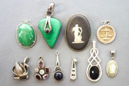 A collection of ten pendants of variable designs to include two Wedgewood cameos.