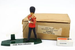 A Harry E Tunnicliffe Ltd 'Fine Rich Virginia' smoking display figure of a 'Drum Major'