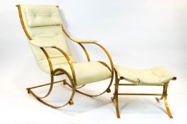 A 20th century rocking chair and matching footstool,