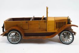 A wooden scale model of a Volvo 1927 OV4, with brass mounted front grille,