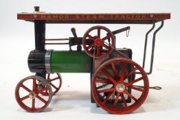 A Mamod T E 1 Steam Tractor, with spare driving belt,