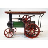 A Mamod T E 1 Steam Tractor, with spare driving belt,