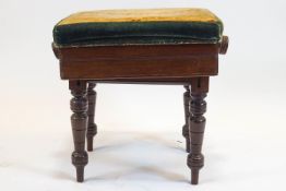 A Victorian mahogany rectangular piano stool with lift up seat on turned tapering legs, 51.