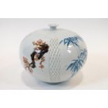 A Japanese porcelain vase of melon form with incised work and panels decorated with bamboo,