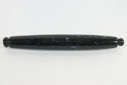 A Nailsea speckled green slag glass rolling pin, 37cm with a Nailsea white glass flask,
