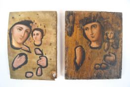 Two Russian icons, painted with fragmentary portraits outlined in black in the Byzantine style,