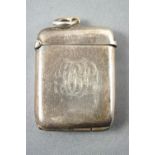 A silver vesta of plain, flat rounded rectangular form, Birmingham 1909