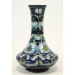 A Moorcroft 'Pavior' vase, flared rim to slender neck and bulbous lower body,