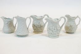 A group of five Portmeirion white biscuit relief-moulded jugs, 20th century moulded marks,