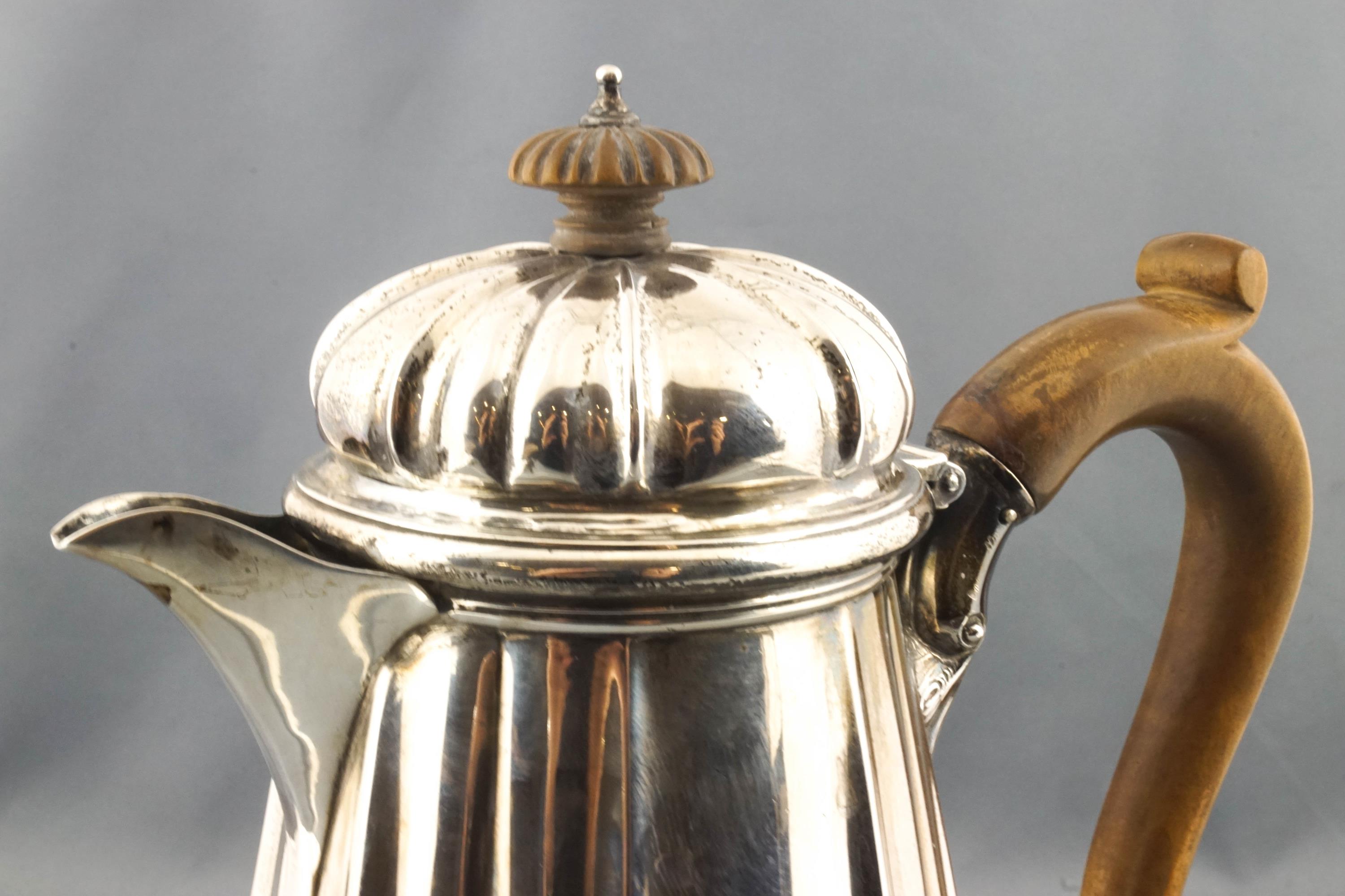 A silver coffee jug, of tapered, ribbed quatrefoil form, with a hinged domed cover, - Image 2 of 2