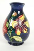A Moorcroft 'Hibiscus' pattern baluster vase, early 20th century, printed and painted marks,