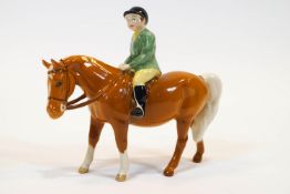 A Beswick porcelain equestrian figure of a child on horseback,