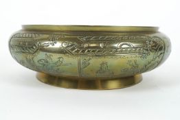 A Chinese gilt bronze shallow bowl, cast with figures in boats, precious objects and flowers,