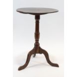 A late 19th century mahogany tilt top table, on turned pedestal and cabriole legs,